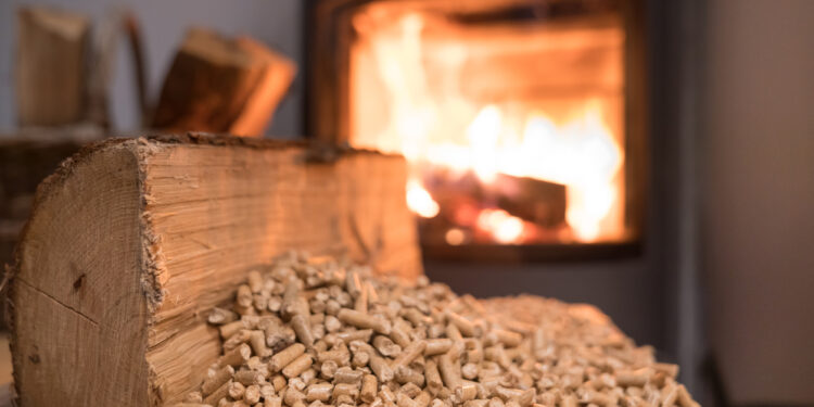 Wood stove heating with in foreground wood pellets - economical heating system concept