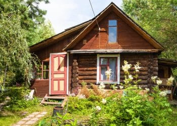 front view of wooden house in russian village in sunny summer day